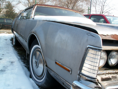 Old Rusty Chevy With Snow In Driveway